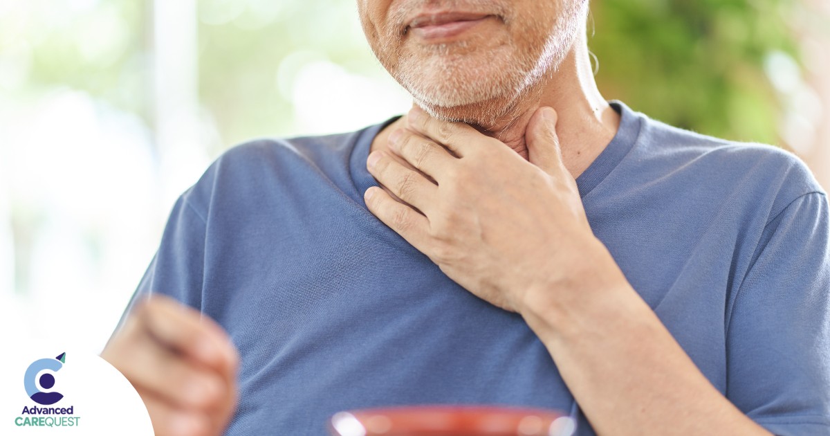 An older adult holds his throat representing dysphagia which can affect senior health.