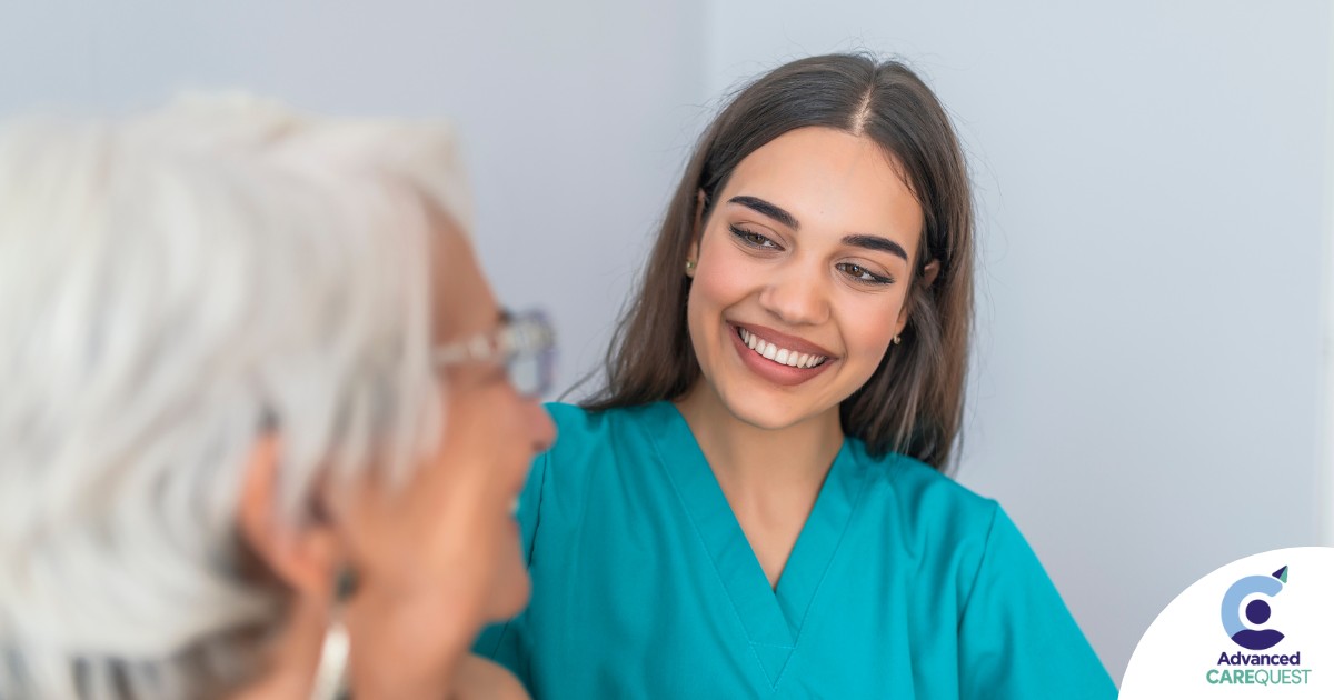 A caregiver smiles with an older client showing the results of successfully starting a new caregiving job.