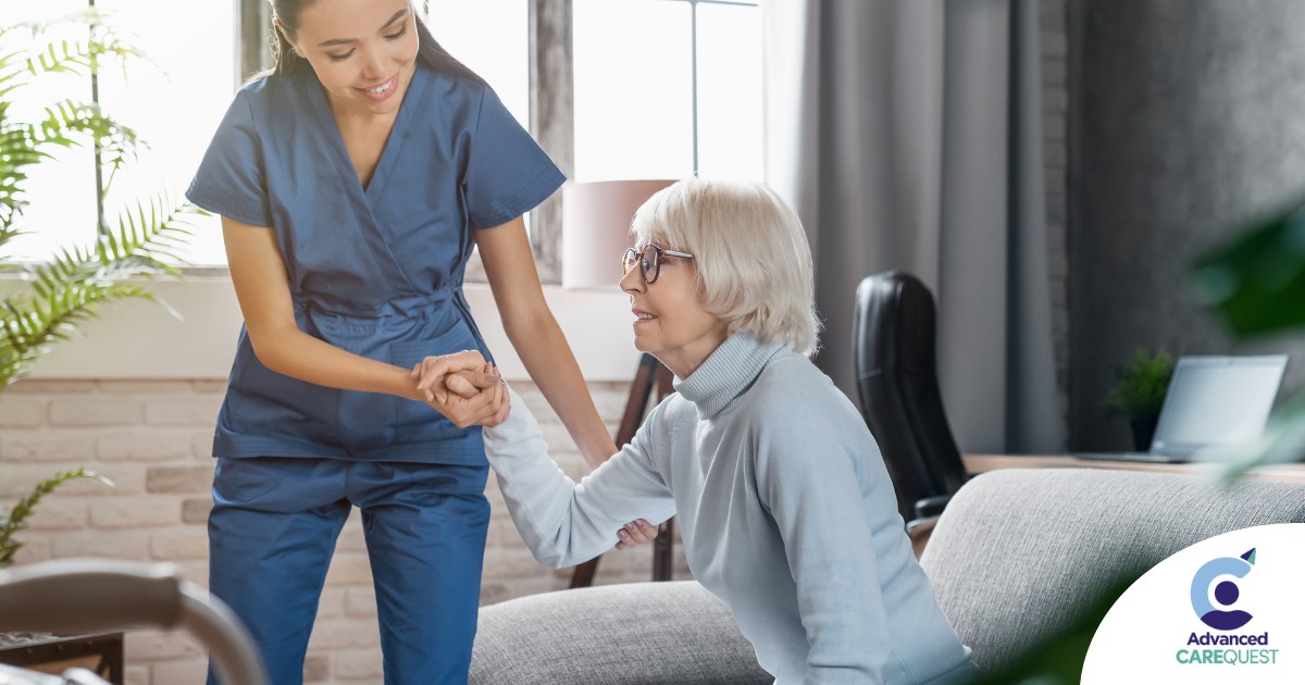 A caregiver demonstrates her caregiver skills by helping an older adult get up.