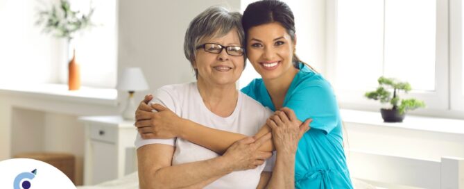 A caregiver hugs an older client, representing how a trustworthy caregiver cares for clients.