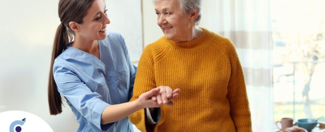 A caregiver helps a client get around, demonstrating one of the job duties of a caregiver.