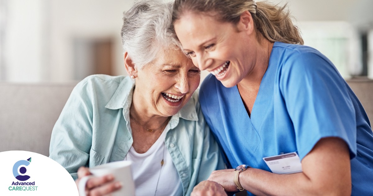 A woman in scrubs laughs with a senior woman, representing how caregiving can be a great career choice.