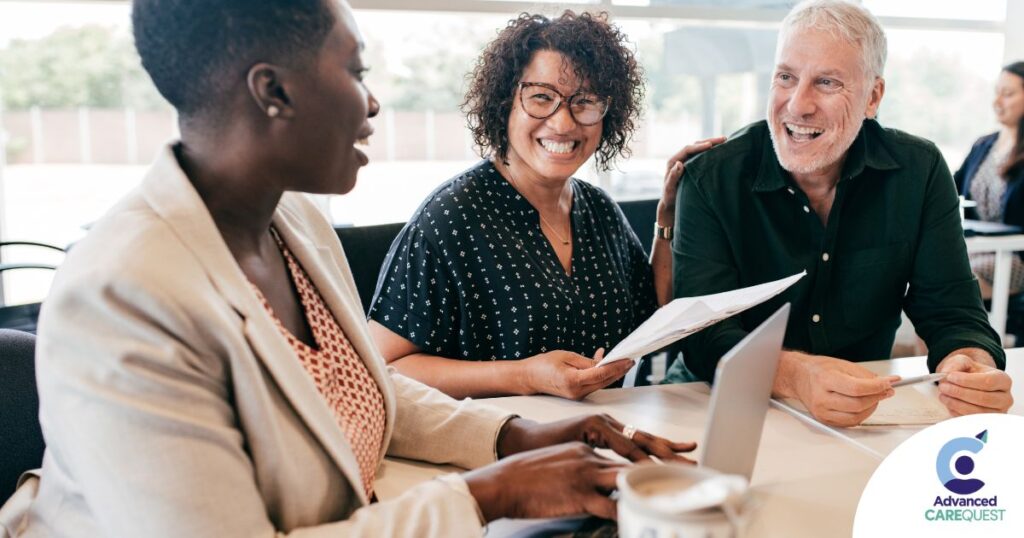 A couple talks with and advisor, representing the type of preparation that is crucial for successful senior care planning.